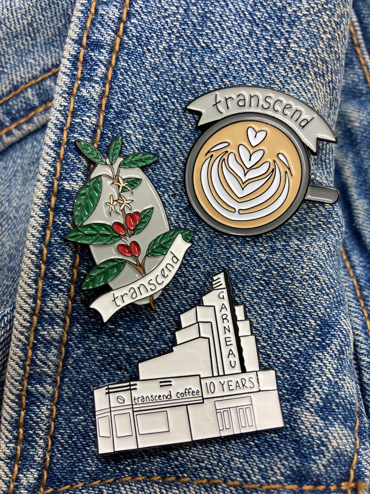 Transcend enamel pins